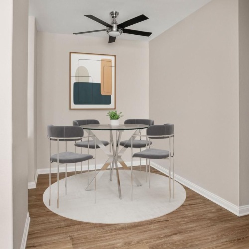 a kitchen with a table and chairs