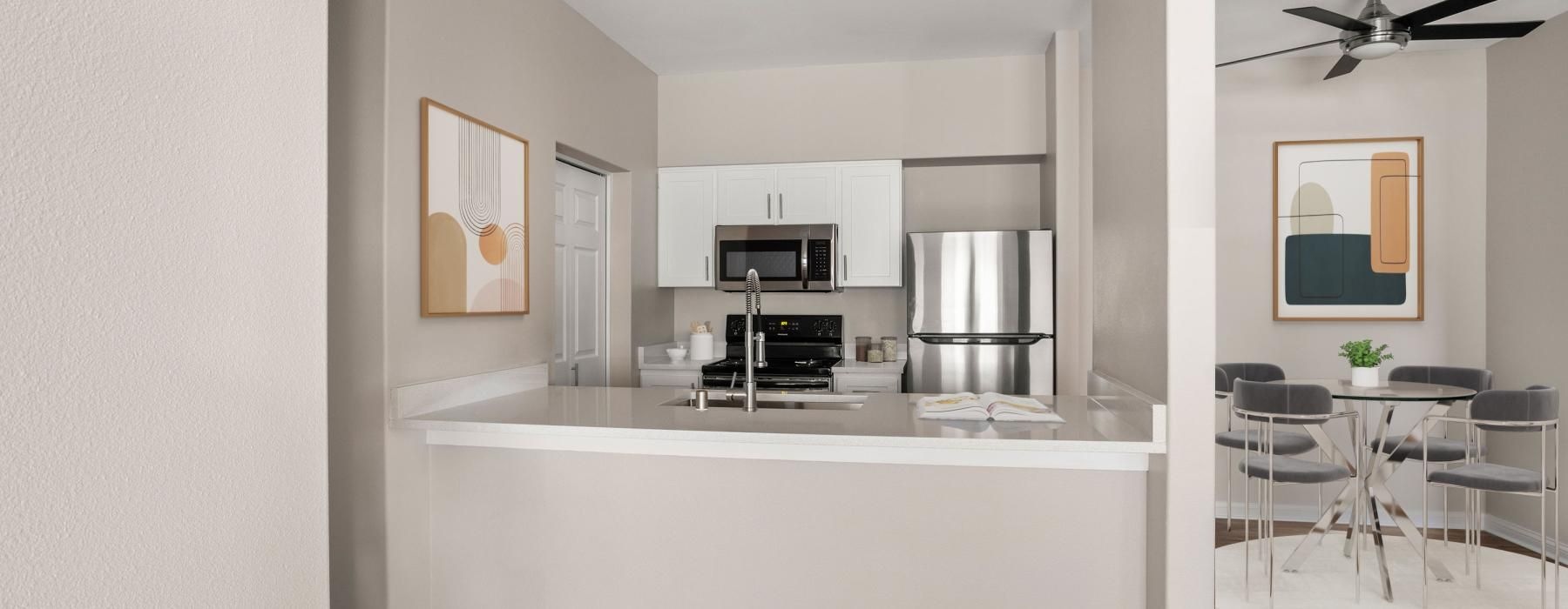 a kitchen with a white counter top