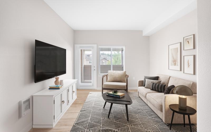 a living room with a tv and couches
