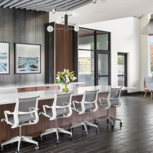 a room with a bar and chairs