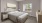 a bedroom with a large mirror