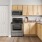 a kitchen with wooden cabinets