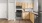 a kitchen with wooden cabinets