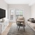 a living room with a tv and couches