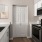 a kitchen with white cabinets