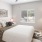 a bedroom with a fan