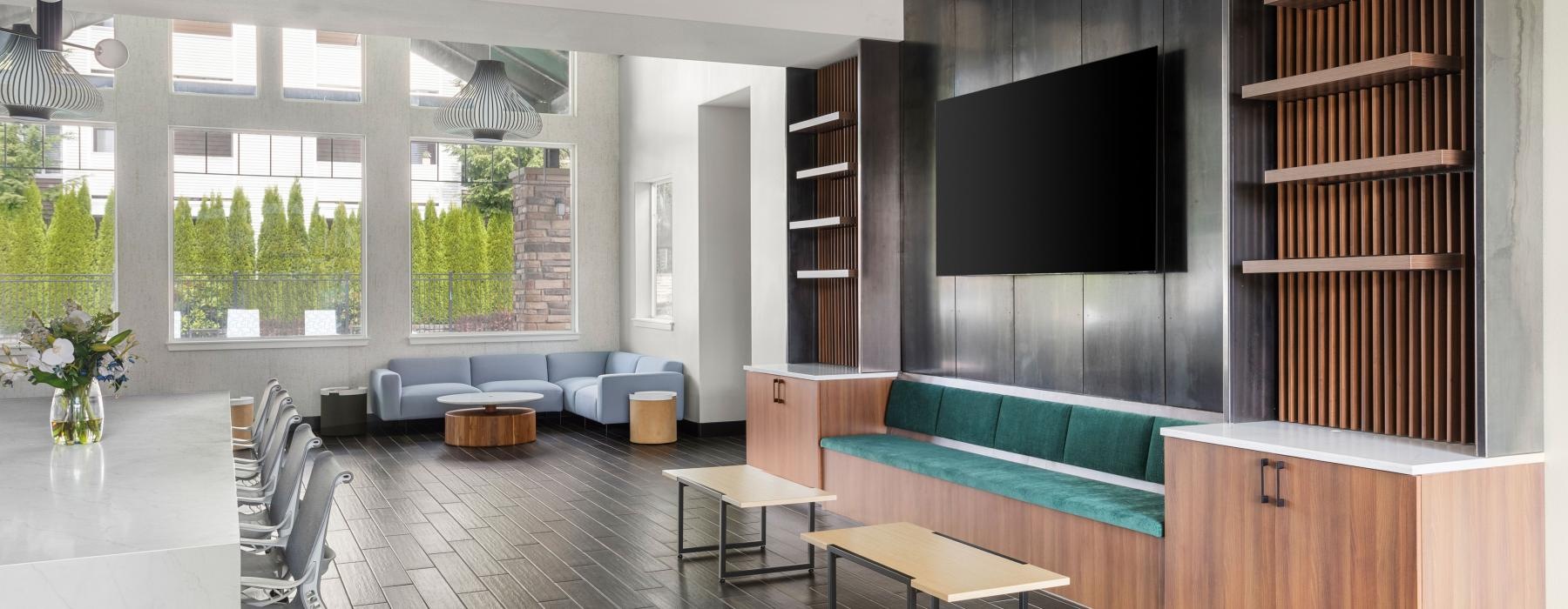 a room with a tv and couches