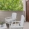 a couple white chairs in a room